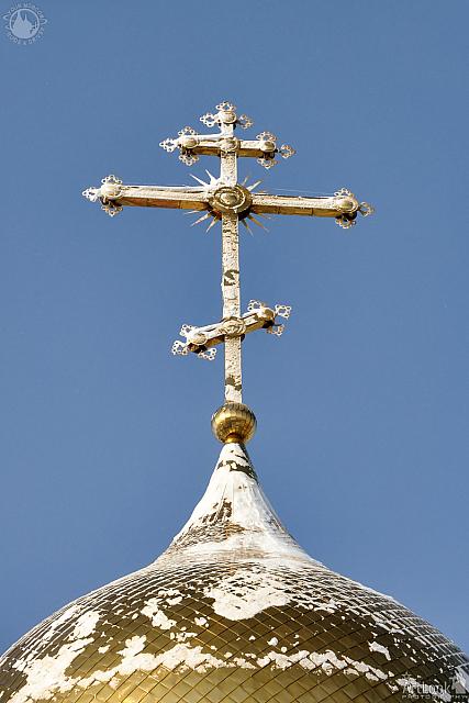 Gilded Russian Orthodox Cross on the Church Cupola in the Snow