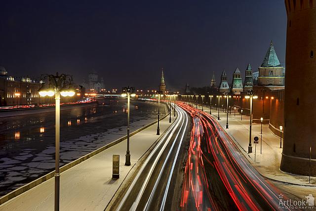 Traffic Lights on Kremlin Embankment During Snowfall at Twilight