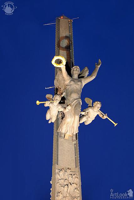 Bronze Statue of Nike with Figures of Angels at Twilight