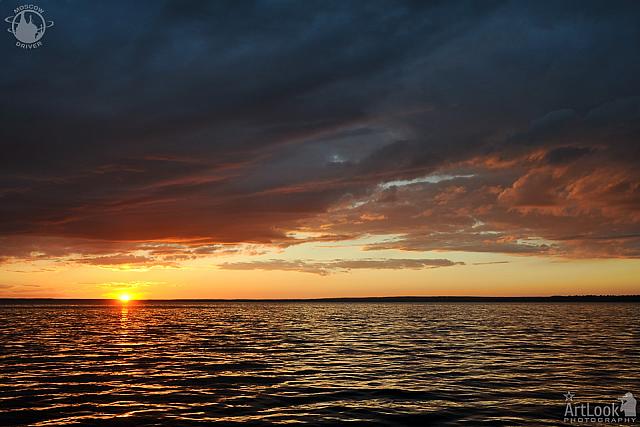 Amazing Sunset with Golden Light over Clouds at Pleshcheyevo Lake