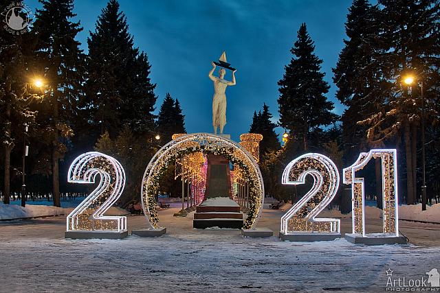 2021 New Year Sign and Girl with Sailboat in Twilight