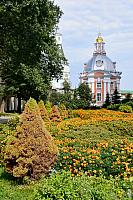 Flowers and small Smolenskaya Church on the grounds of Lavra