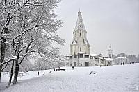 Tent-Roofed Ascension Church Framed by Trees in Snowfall