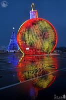Colored Christmas Tree Ball with Reflection in Morning Twilight