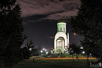 Church of St. George framed by Trees on Poklonnaya Hill at Night