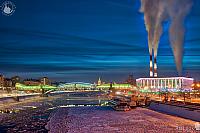 Icy Moskva River and Steam Clouds Rising Up in Winter Twilight