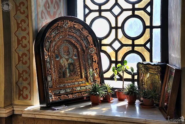 Old Icons and Flowers on the Window Sill