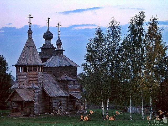 Sunset over the Wooden Churches and Birch Trees