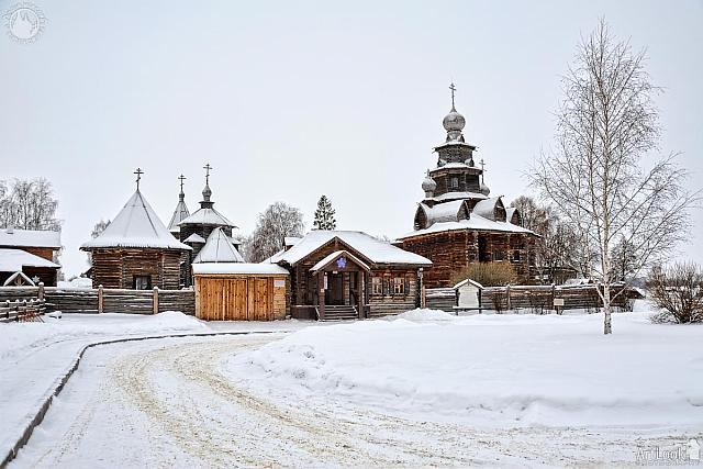 At the Entrance into Museum of Wooden Architecture Covered Snow