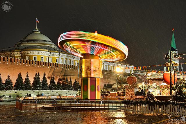 Colorful Spinning Carousel at the Red Square in Snowfall