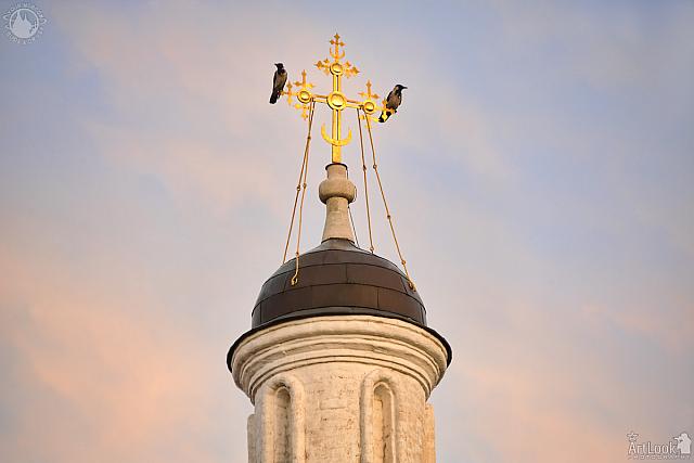 Two Crows Overlooking Tsar’s Courtyard From a Cross at Sunset