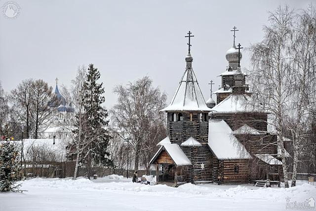 Snow-Covered Ensemble of Wooden Churches Framed by Trees