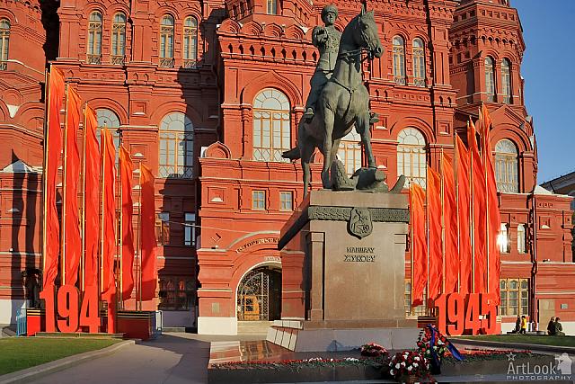 Red Banners and Flowers at Monument to Zhukov at Sunset