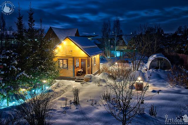 Snow-covered Dacha in a Winter Twilight