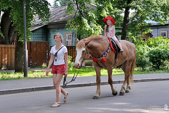 Lovely Girl in Red Hat on Horseback in Suzdal