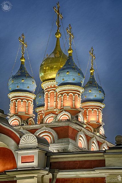 Illuminated Domes of St. George Church in Snowfall