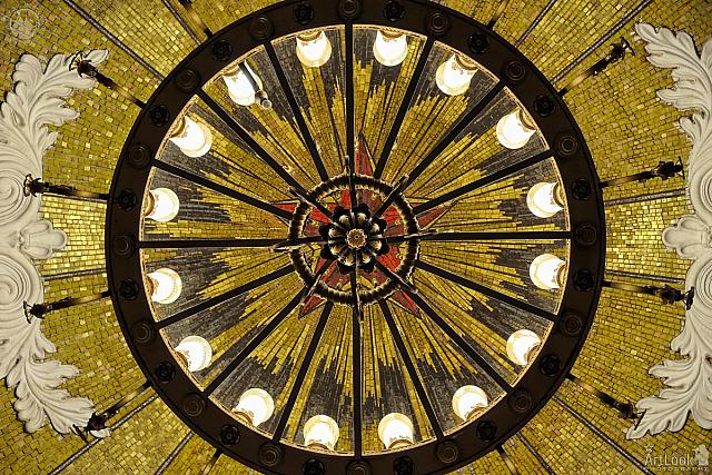 Under Chandelier and Mosaic Panel of Red Star with Gold Beams