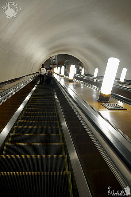 Going Down the Long Escalator at Smolenskaya Metro Station
