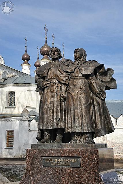 Monument to Peter and Fevronia against  Trinity Church Domes