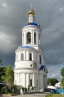 Gate Assumption Church with Bell Tower Against Storm Clouds