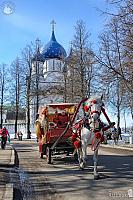 Horse-Drawn Carriage on Kremlevskaya st. against Nativity Cathedral