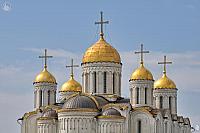 Golden Domes of Assumption Cathedral Against the Blue Sky
