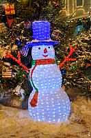 Funny LED Snowman in a Blue Hat on the Red Square