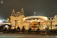 Rotating Carousel at Christmas Market on Red Square at Night