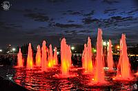 Colored Red Light Fountains in Victory Park Against Dusk Sky