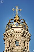 Golden Crown With Cross of Dubrovitsy Church Against Blue Sky