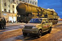 Military Pickup UAZ and ICBM Yars in Twilight