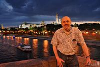 In Background of Moscow Kremlin under Cloudy Sky in Twilight