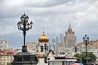 Old-Style Street Lamps and Buildings of Moscow under Cloudy Sky