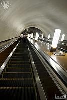 Going Down the Long Escalator at Smolenskaya Metro Station