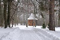 Way to the Old Wooden Chapel in Woods in Snowfall