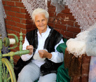 Russian Senior Lady Shows Master-Class in Spinning Yarn
