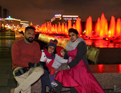 At the Red Illuminated Fountains in Victory Park at Night