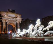 Lighted New Year Horses at Triumphal Arch in Dusk. Front Angle