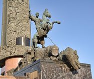 Saint George Striking the Dragon Against Blue Sky